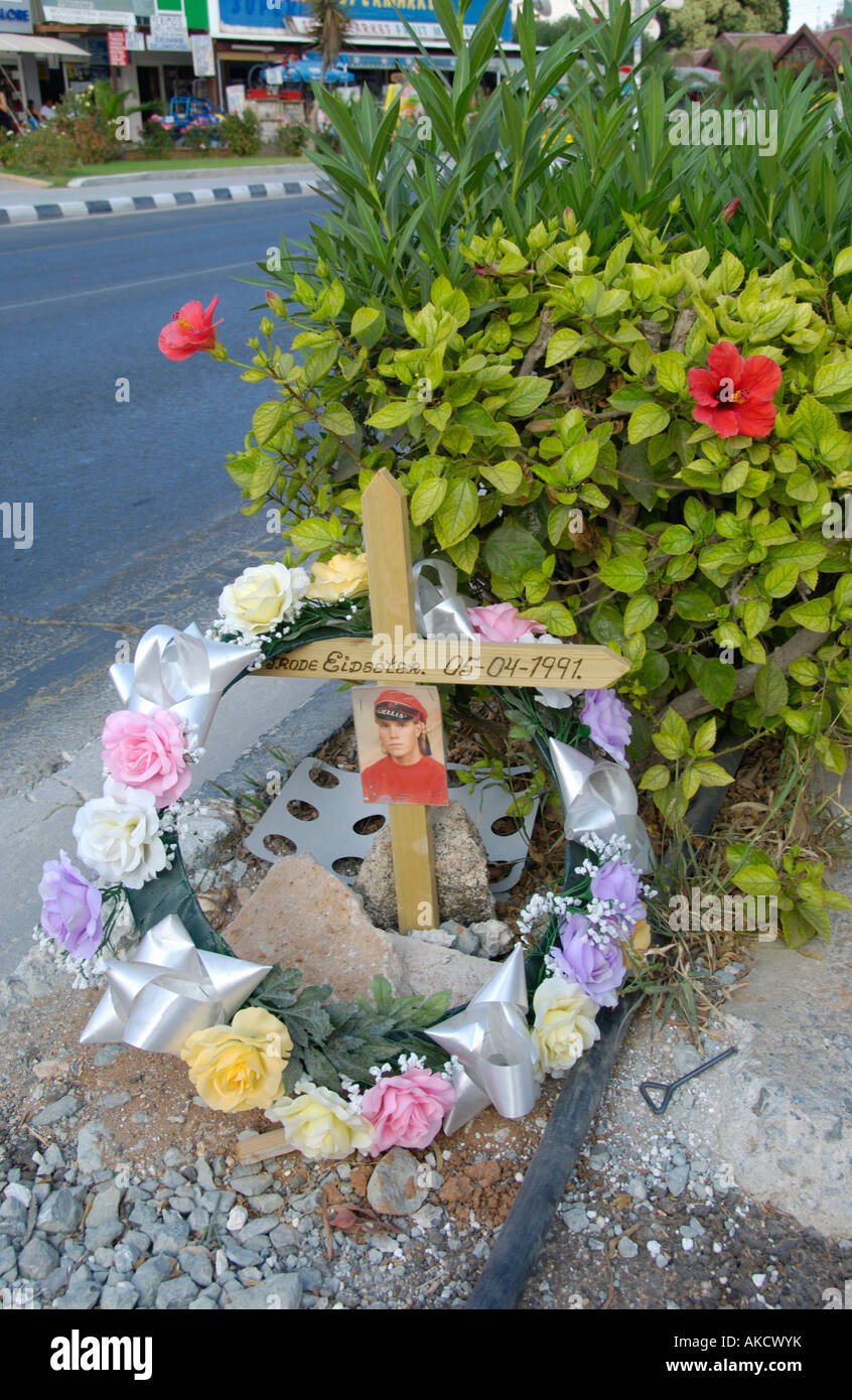 Roadside memorial wreath and cross with photo on the Mediterranean ...