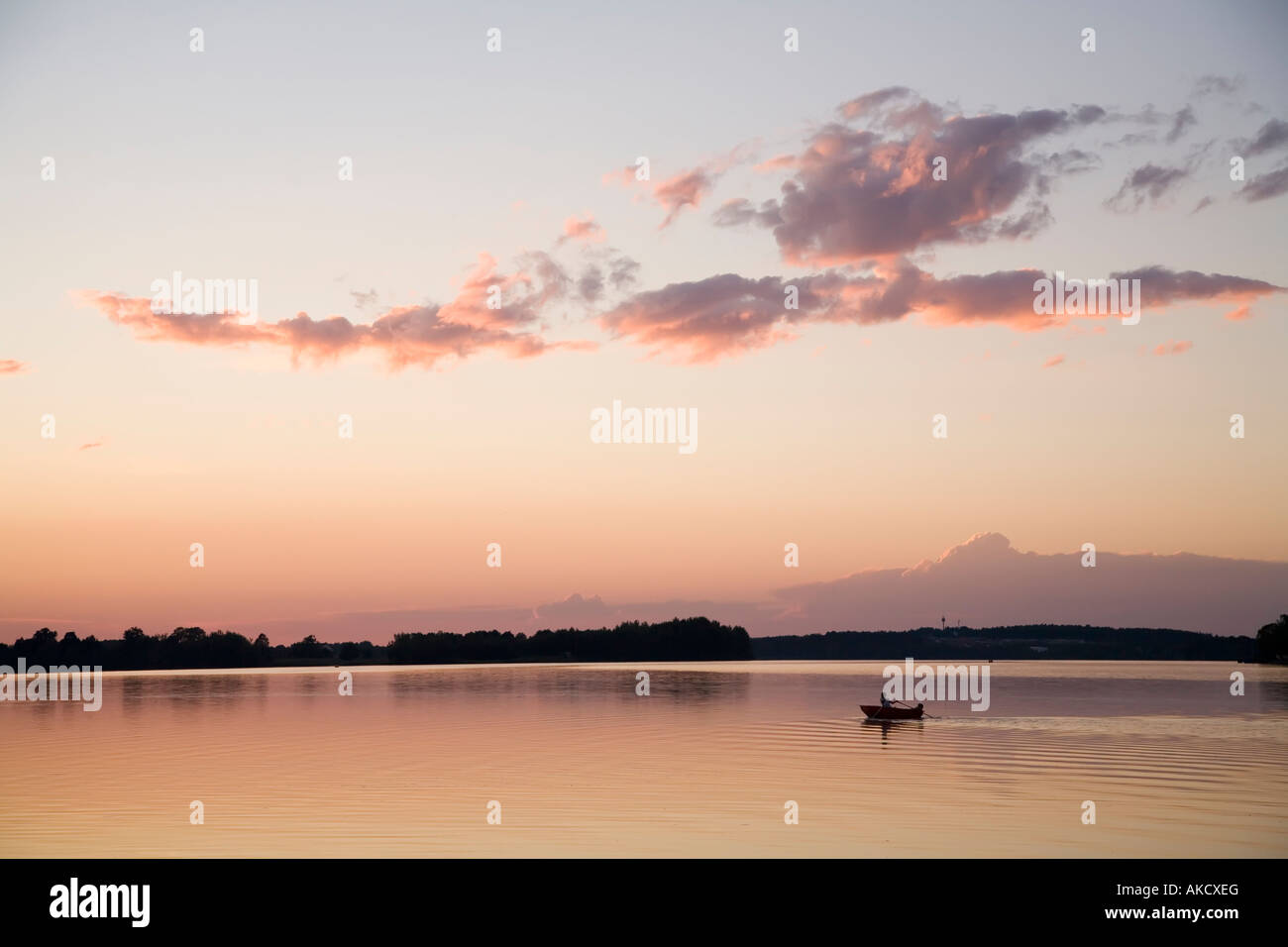 Rowing boat on Municky Rybnik lake at sunset Czech republic Stock Photo