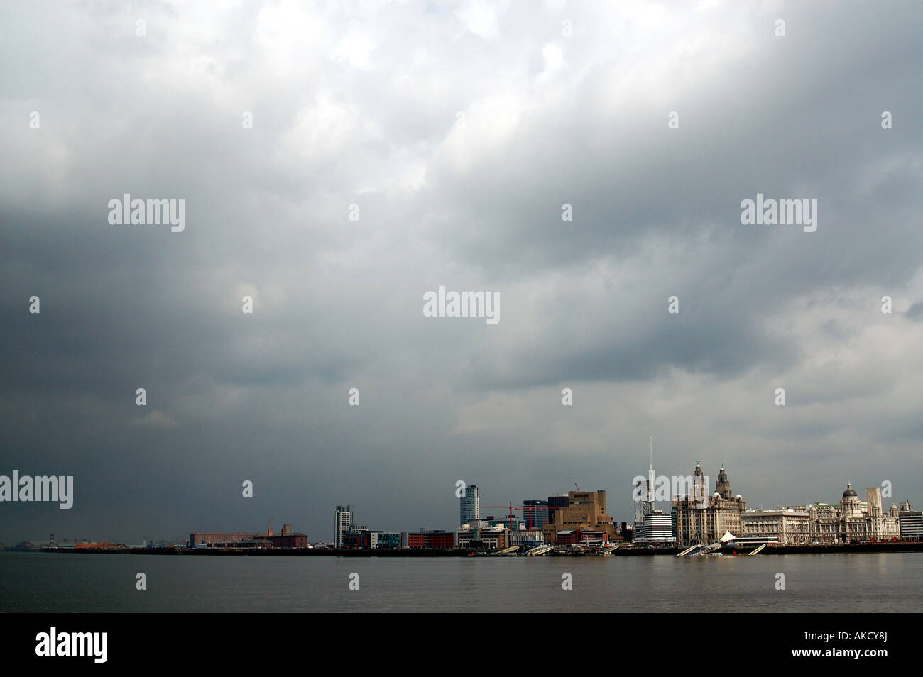 View of the River Mersey, Pier Head and waterfront buildings on a stormy day, Liverpool, UK Stock Photo