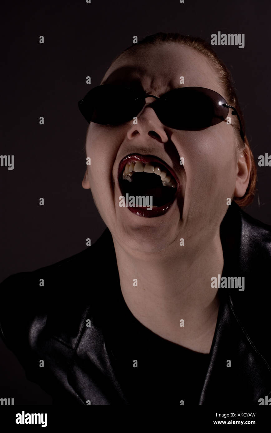 screaming woman with sunglasses Stock Photo