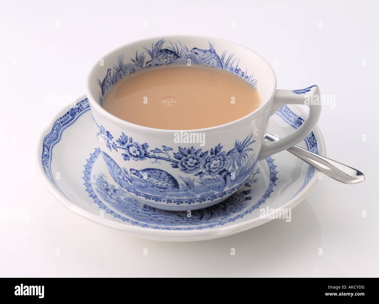 An antique Wedgwood willow pattern fine china cup and saucer of tea on