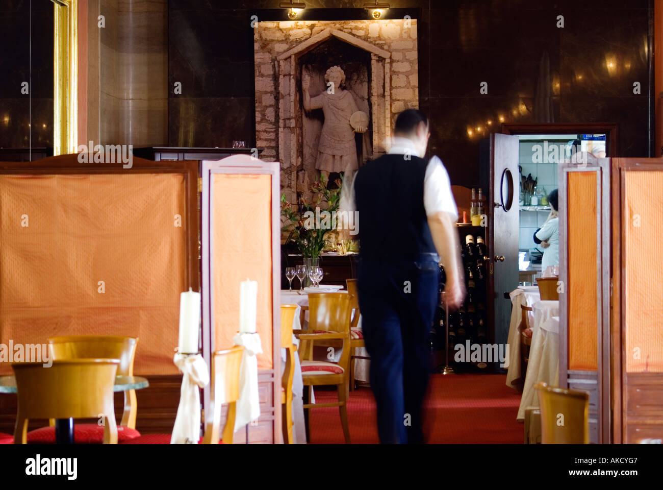 South-East Europe, Croatia, Dalmatia, Sibenik, waiter in restaurant, rear view Stock Photo