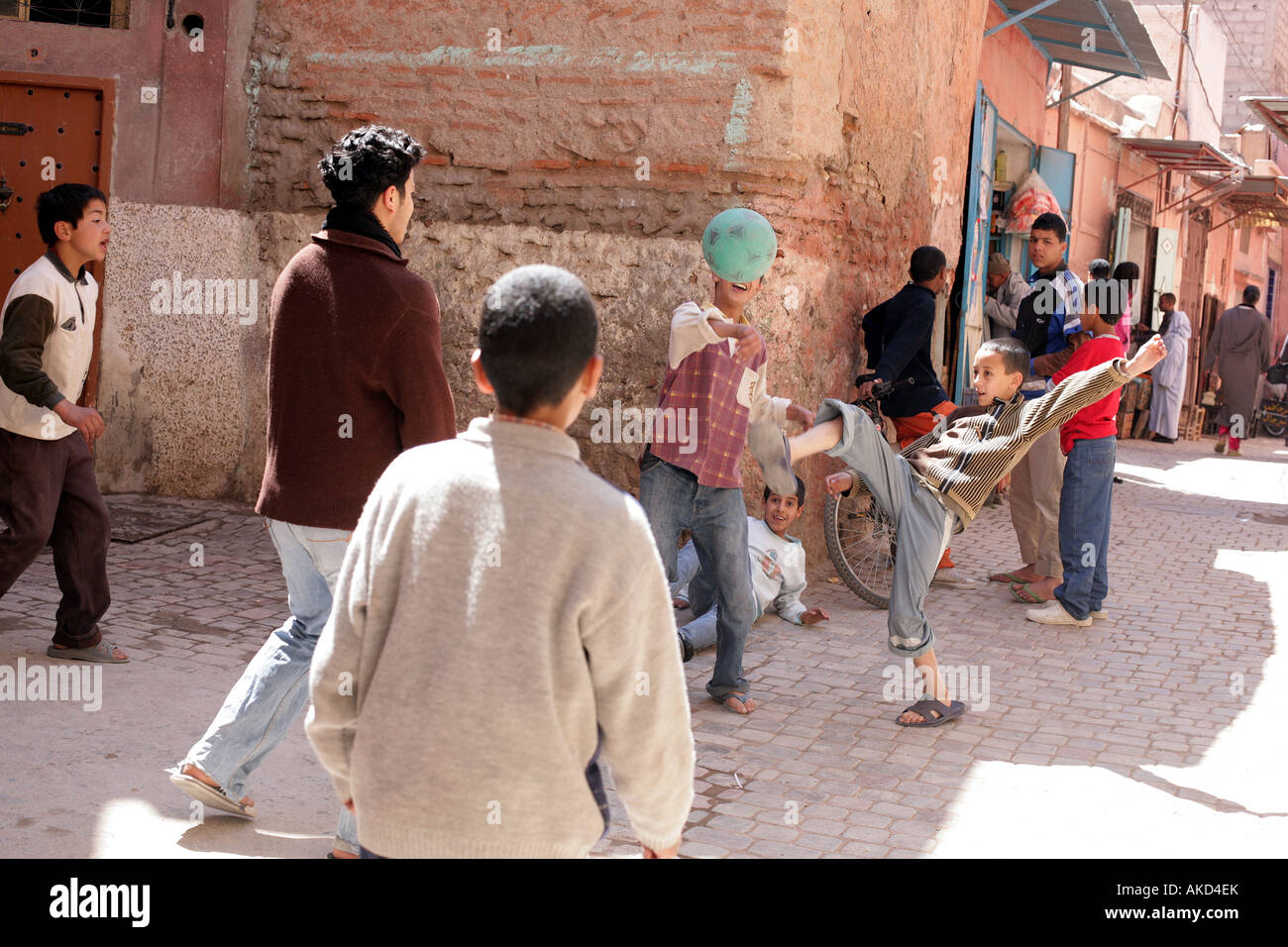 Playing football in the street Marrakech Morocco north Africa March 2007 Stock Photo