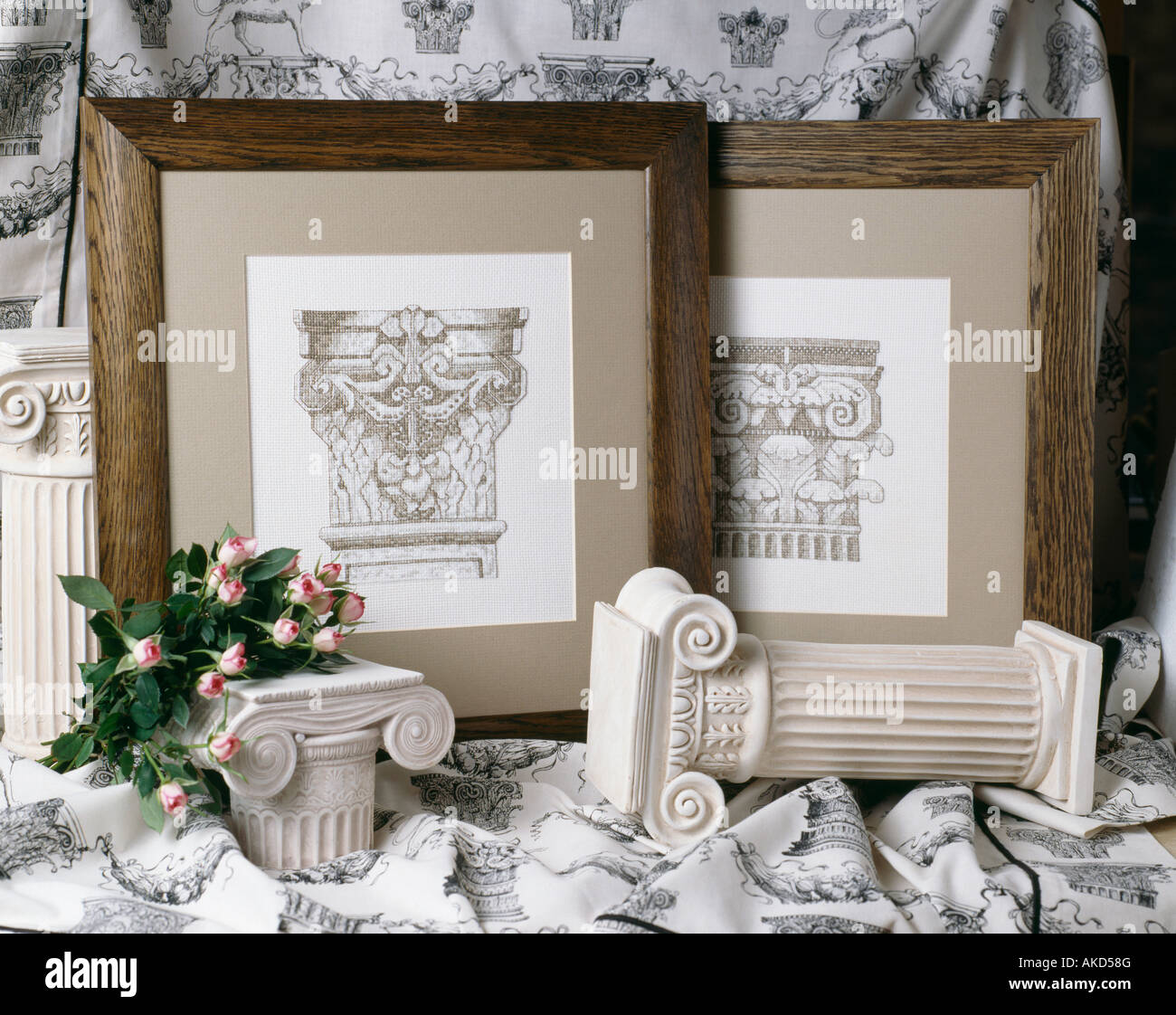 Wooden framed neo classical etchings with plaster Greek style columns Stock Photo