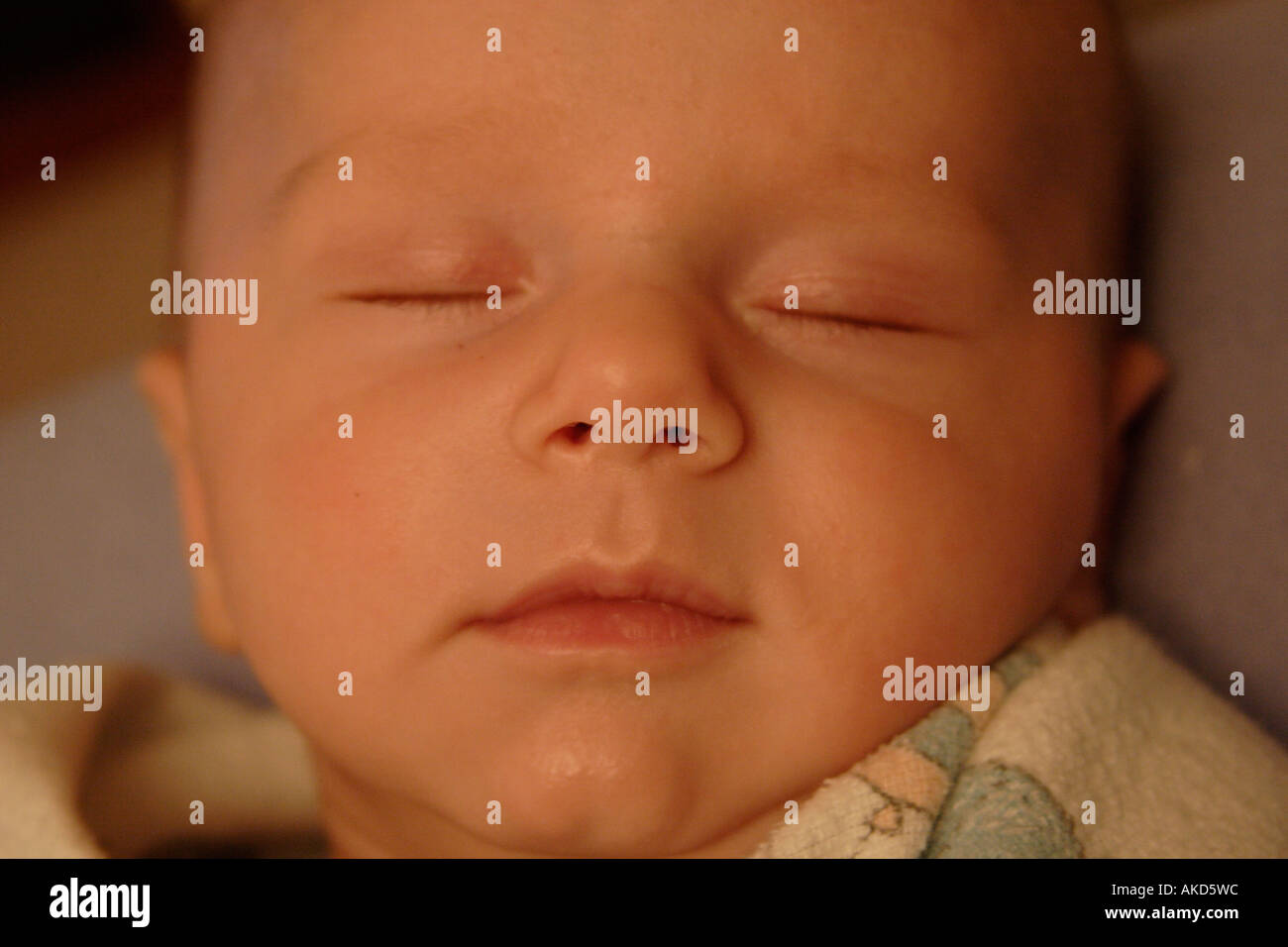 Contented sleeping newborn baby hi-res stock photography and images - Alamy