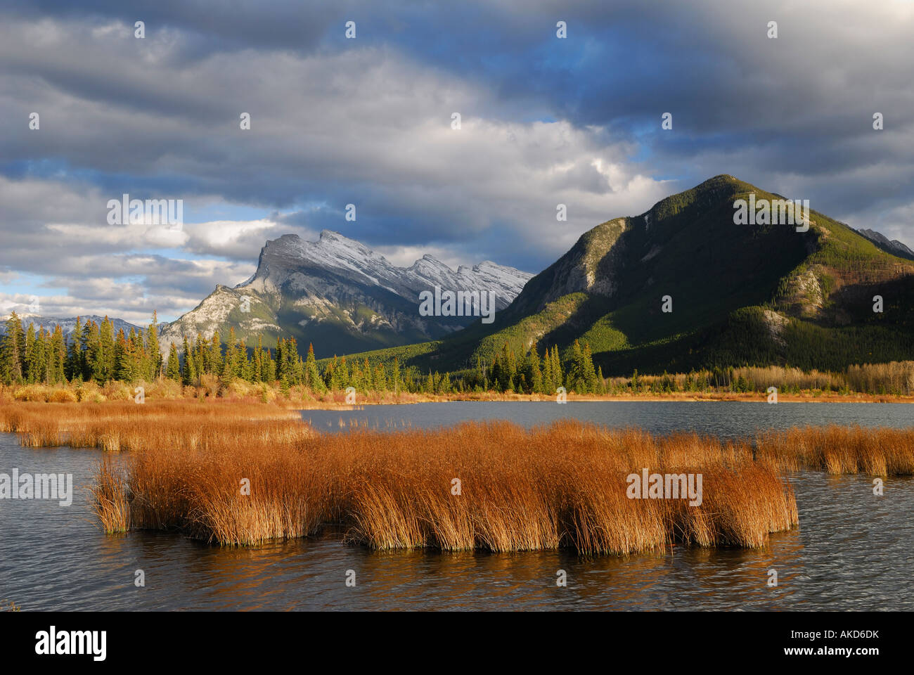Clouds at third Vermillion Lake in Fall with gold grasses, Mount Rundle, Sulphur Mountain Stanton Peak, Canadian Rocky Mountains Banff National Park Stock Photo