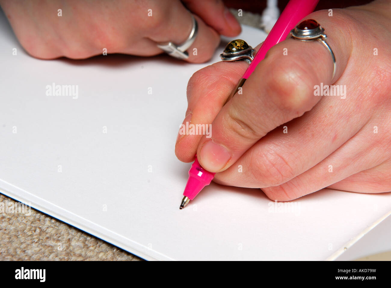 Hand writing on blank paper. Stock Photo