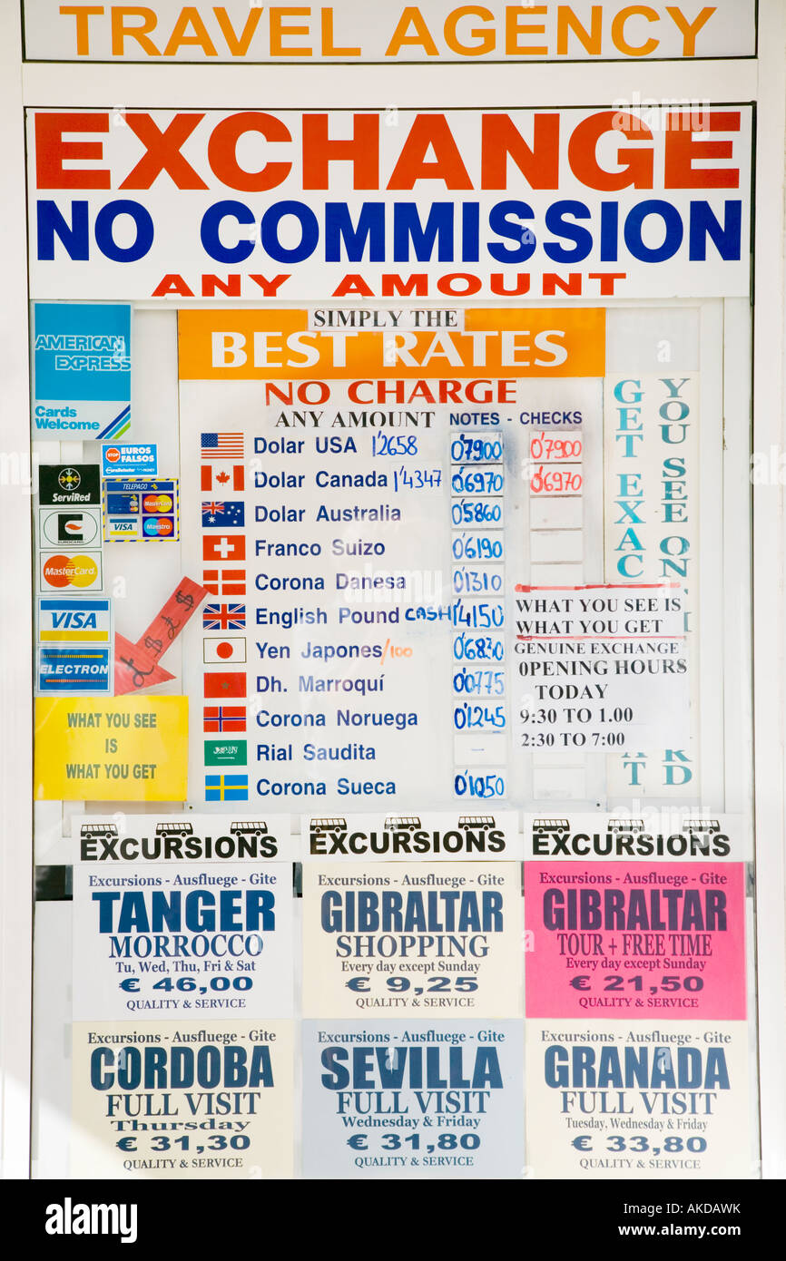 Advertisement in Spanish currency change shop window Stock Photo Alamy