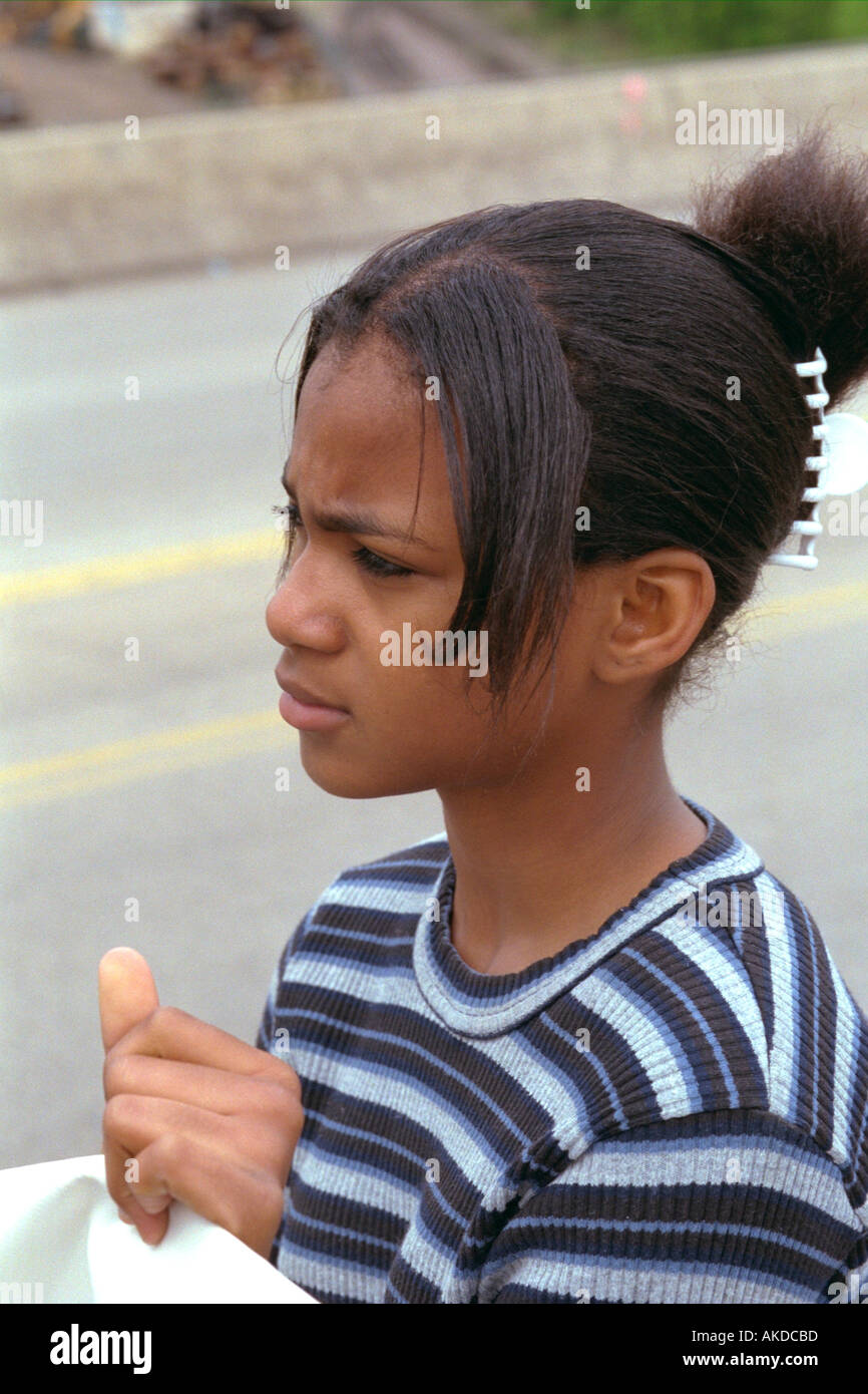 Black teen Girl age 14 looking into the distance worried at Cinco de Mayo Festival. St Paul Minnesota USA Stock Photo