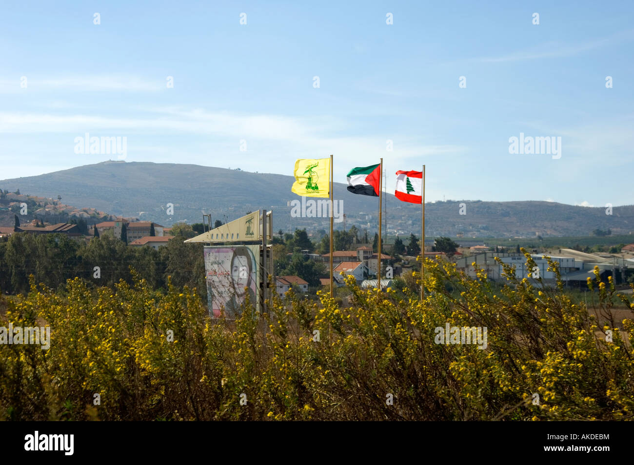 flags of Lebanon Palestine and Hizbullah on the Israeli border Stock Photo