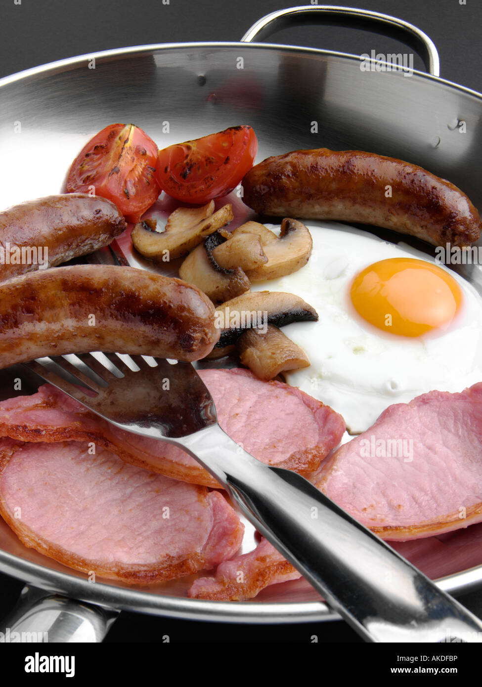 A full English cooked breakfast in a frying pan editorial food Stock Photo