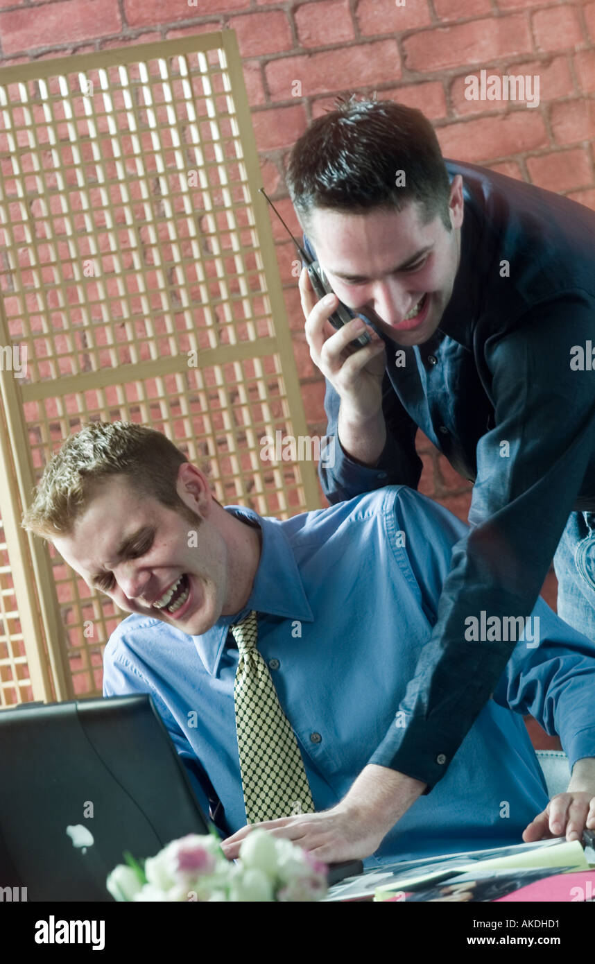 Caucasian business workers laughing in office Stock Photo