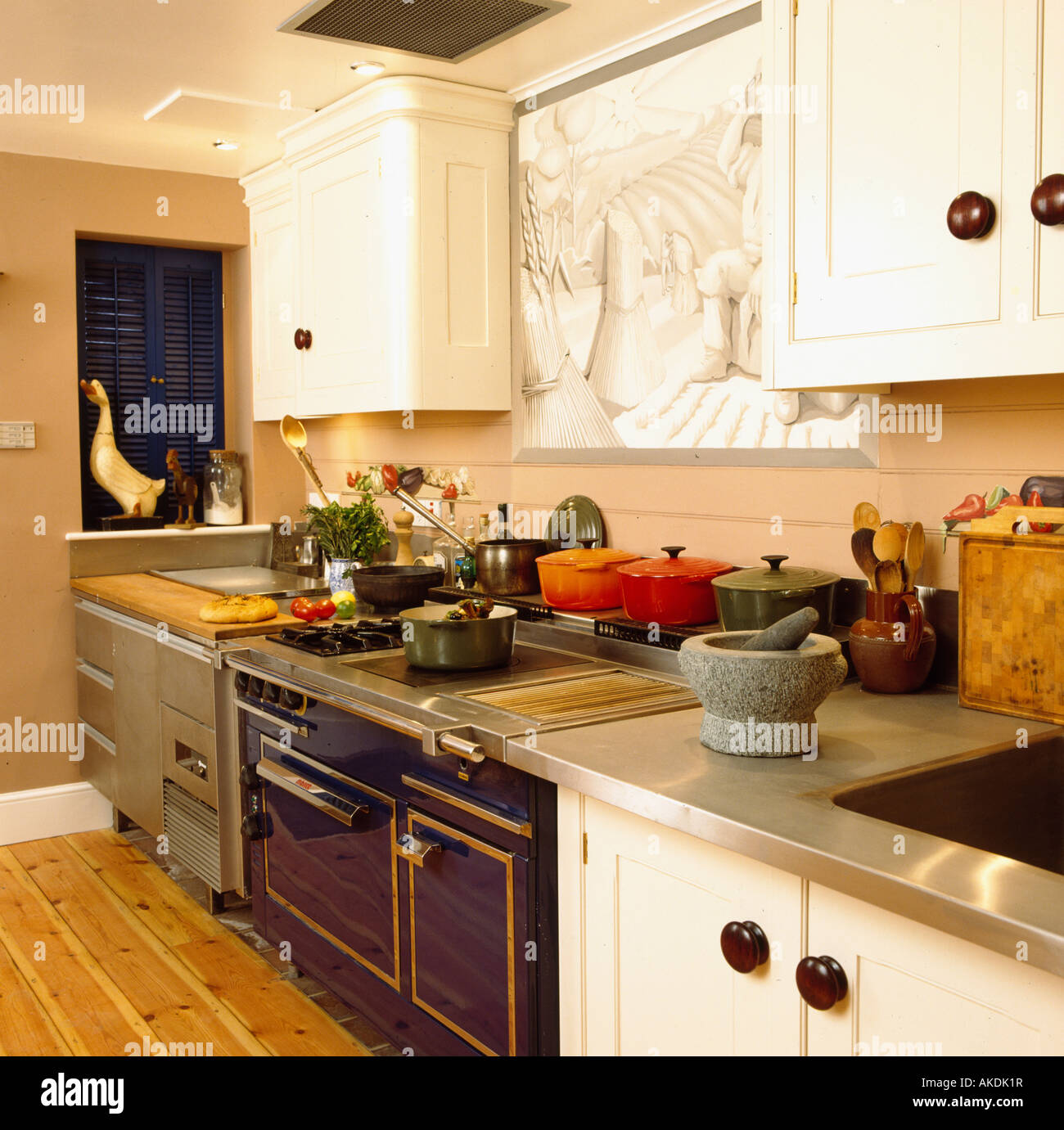 Pestle and mortar on stainless steel worktop in modern kitchen with