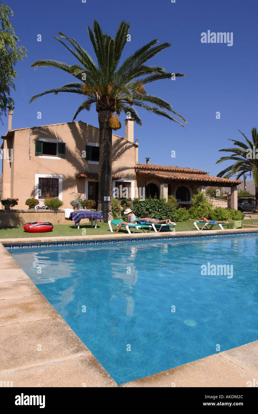 Holiday villa with private swimming pool and palm tree Pollensa Majorca Stock Photo