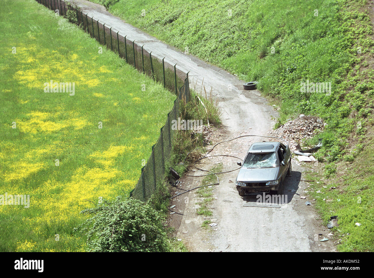 car vandalised and abandoned in secluded lane Stock Photo
