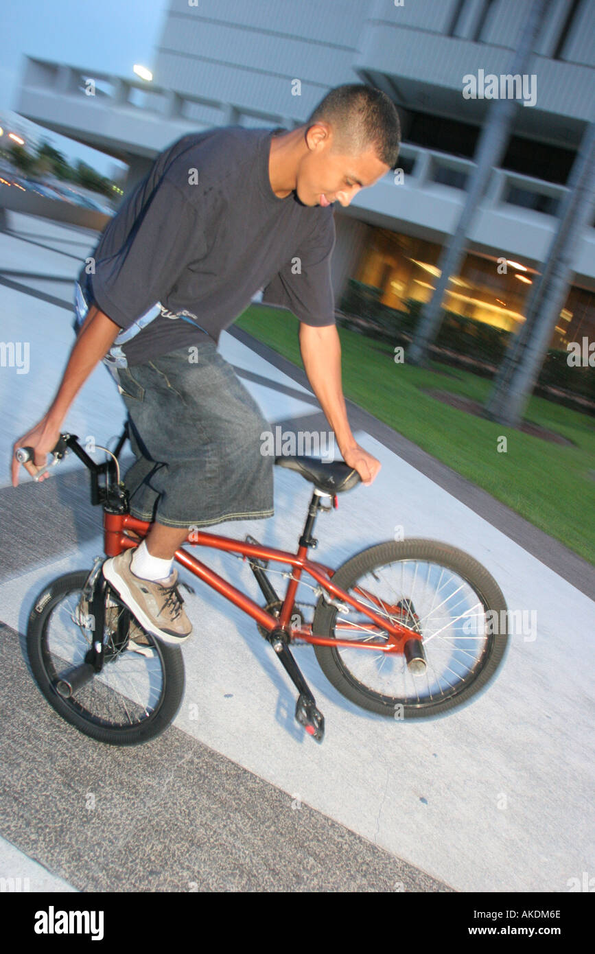 Hispanic Man Riding Bike Hispanic man riding bike beach hi-res stock photography and images - Alamy
