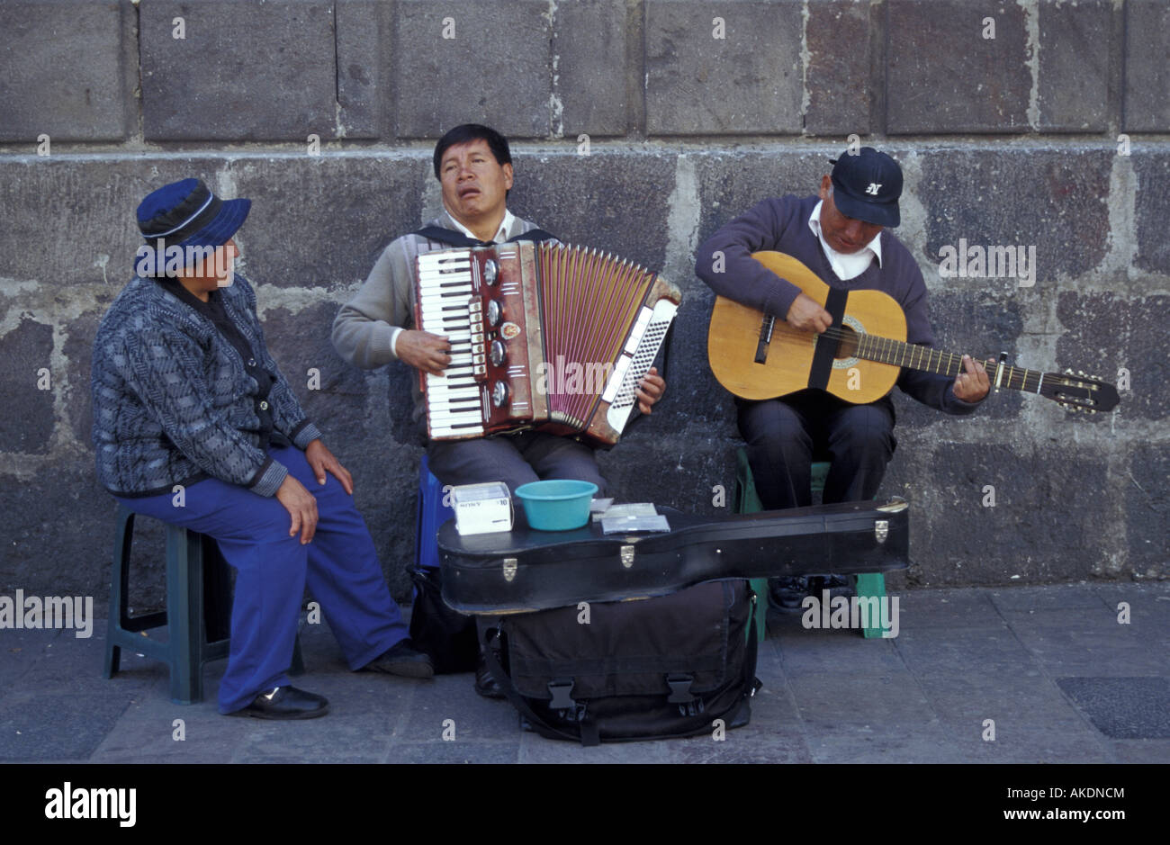 Three street musicians performing in the Old Town, Quito, Ecuador Stock Photo