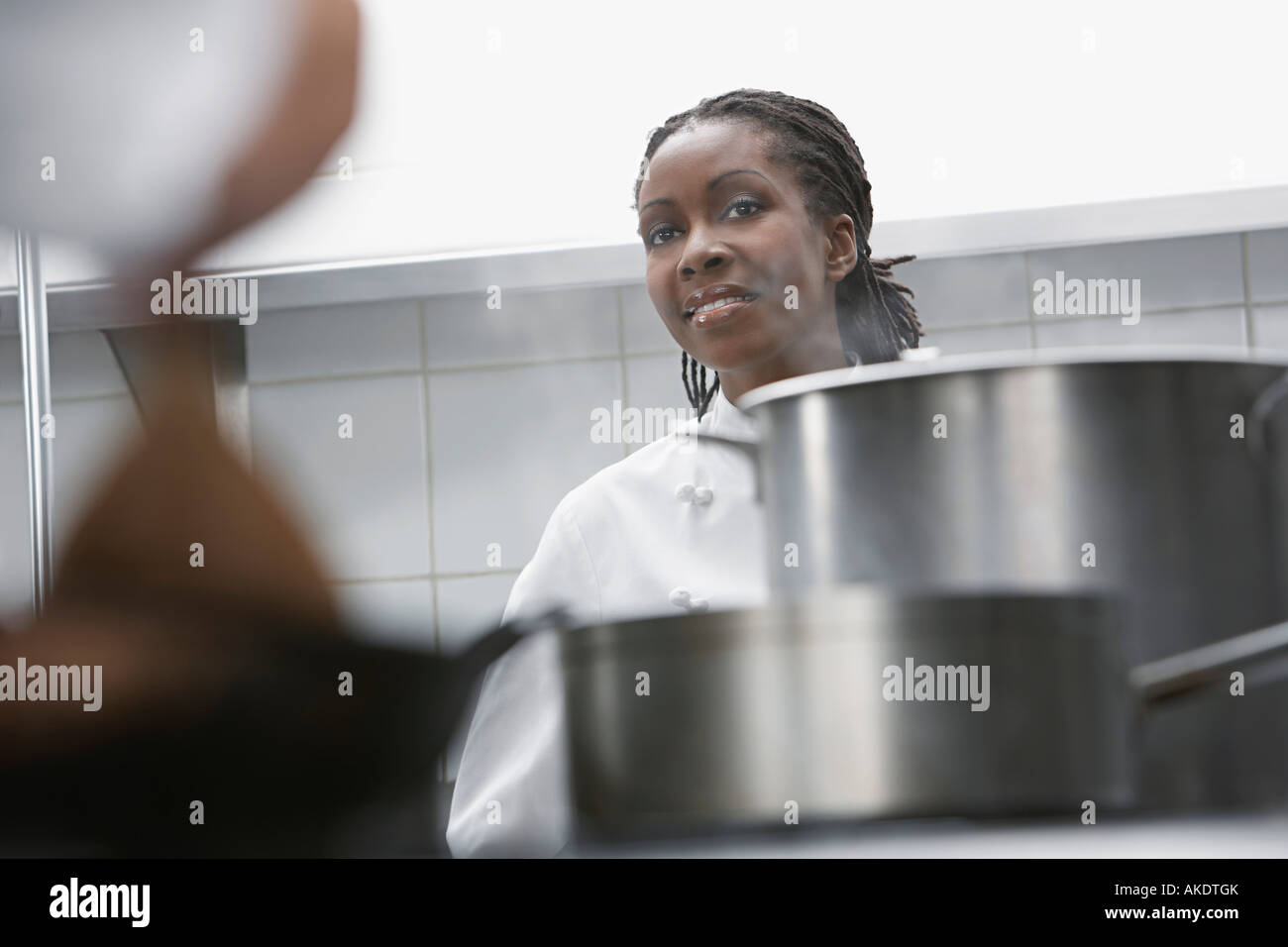 Female chef in kitchen Stock Photo - Alamy