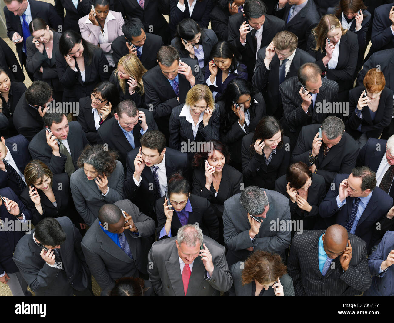 Large group of business people using mobile phones, elevated view Stock Photo