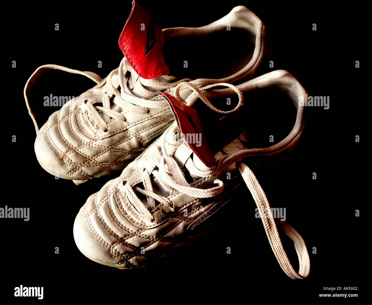 boot football pair set twin together laces leather worn stud soccer shoe  game 2 two together silver white red tongue heel toe Stock Photo - Alamy