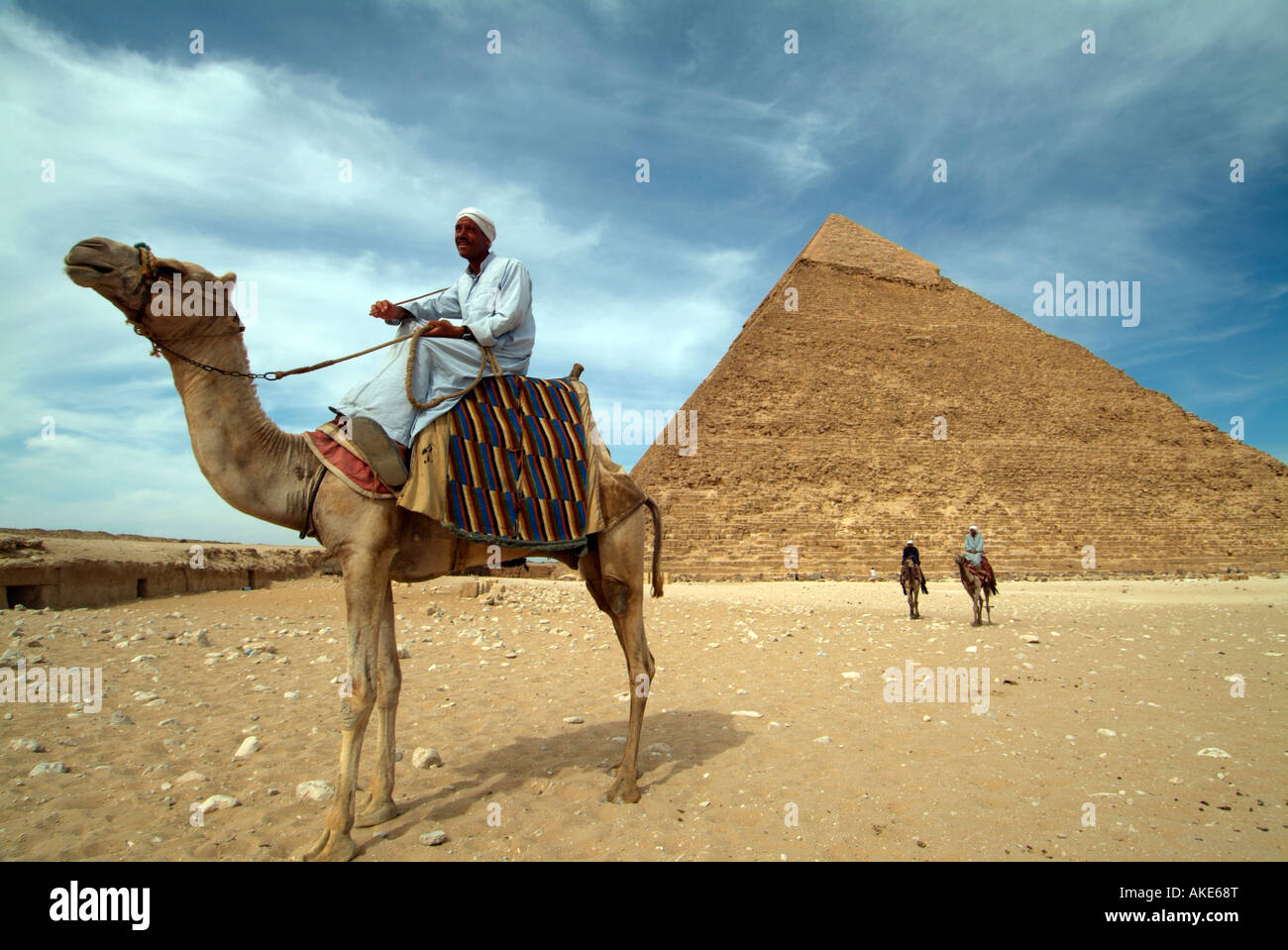 egyptian man dressed in traditional costume clothes sitting on a camel in  front of the pyramid of khafre giza cairo egypt Stock Photo - Alamy, image size:1300x959