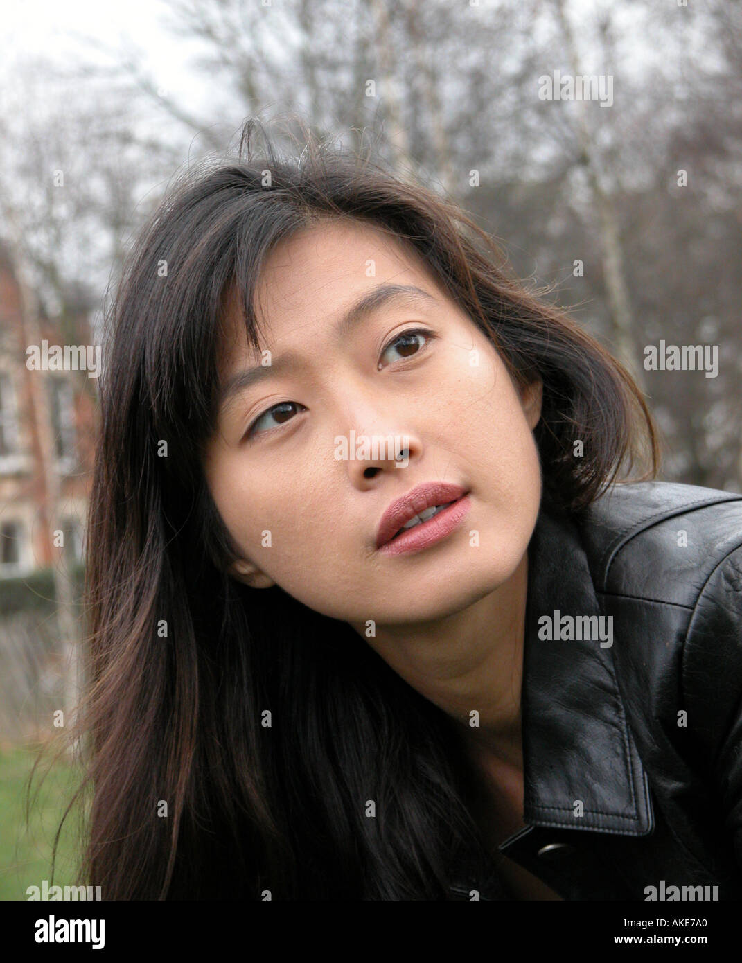 thoughtful look from attractive Asian female Stock Photo - Alamy