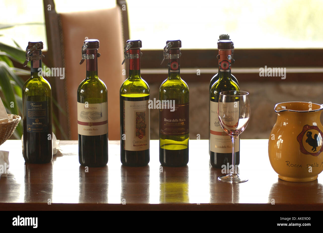 Wine bottles on display at a winery in Tuscany Italy Stock Photo - Alamy