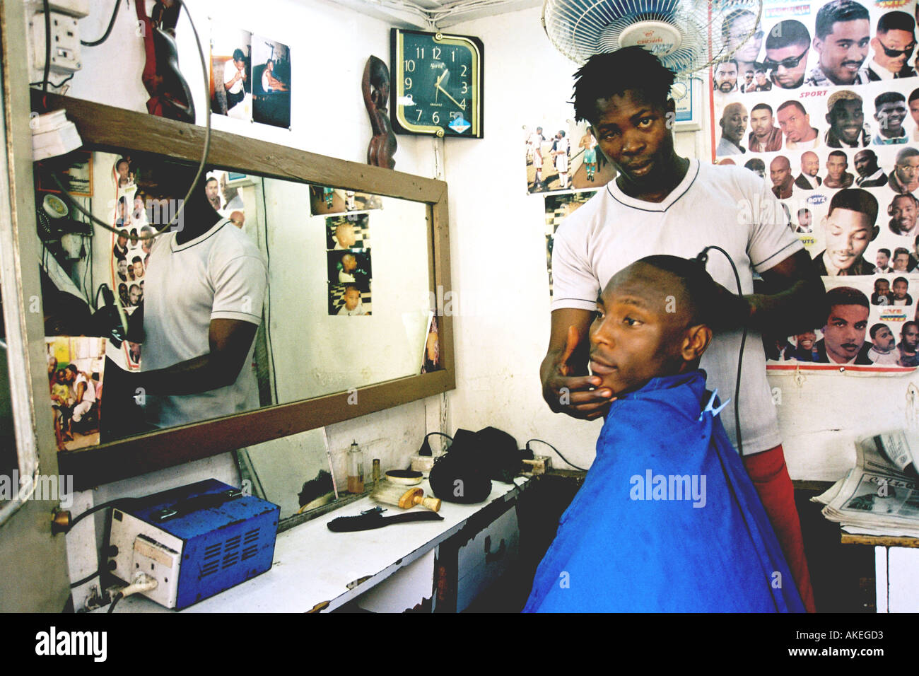 Local barbershop in Obalende downtown Lagos state. Young man is