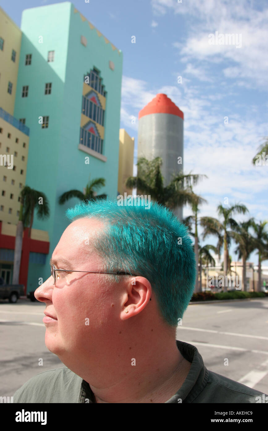 Miami Beach Florida,Washington Avenue,adult adults man men male,turquoise colored hair,dyed,glass block tower 404 Washington Avenue building,visitors Stock Photo