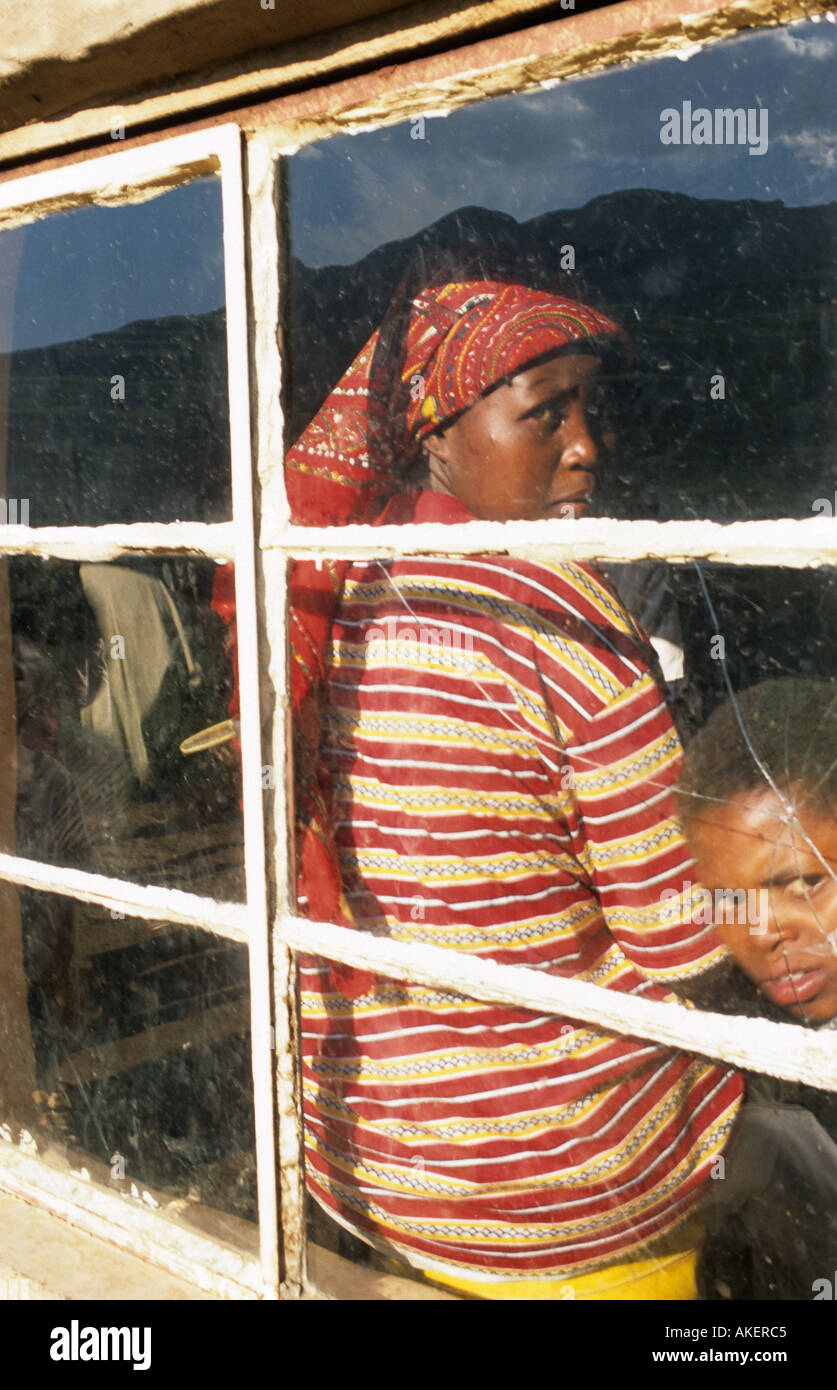 A scene of a woman looking through the window in Kwa zulu natal South Africa Stock Photo