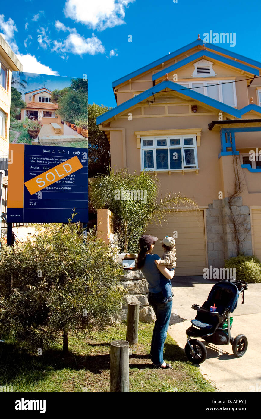 A family standing outside their new home Stock Photo - Alamy