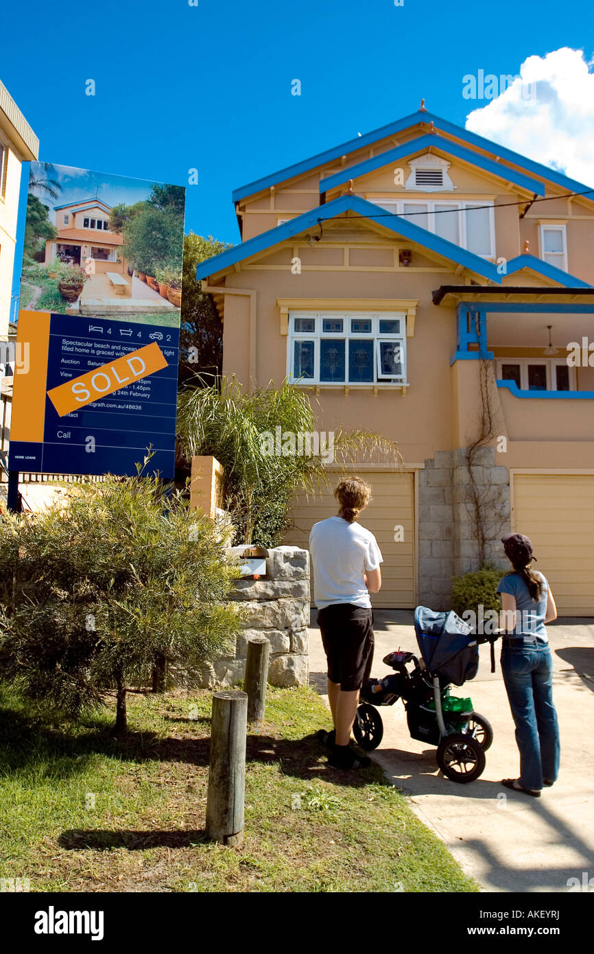 A family standing outside their new home Stock Photo - Alamy