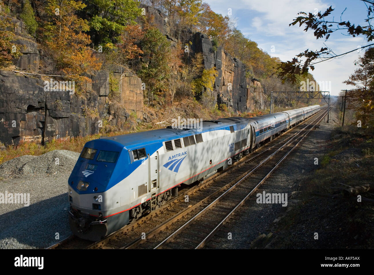 Amtrak passenger train westbound through Little Falls upstate New York Mohawk Valley Stock Photo