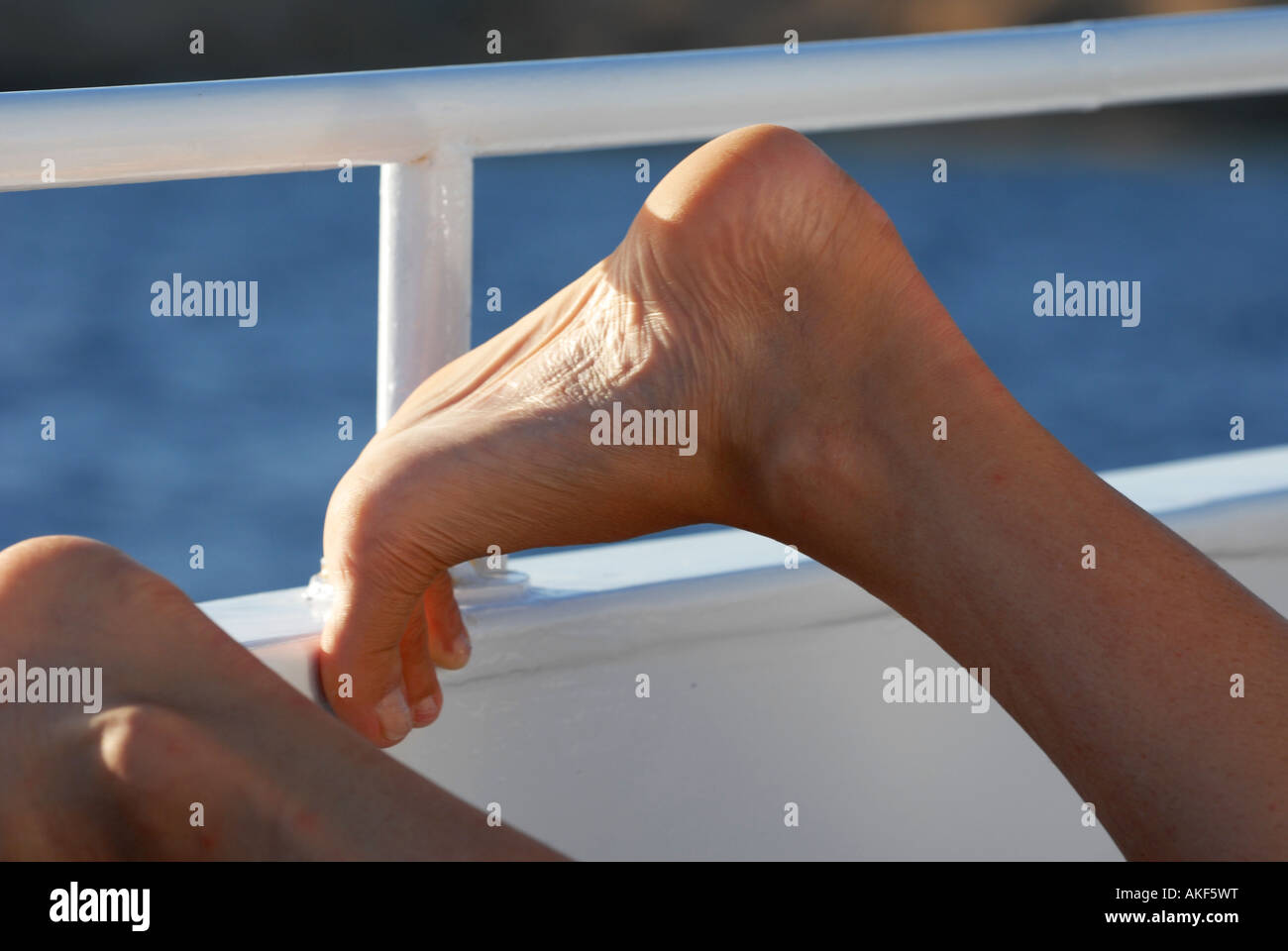 feet on a boat Stock Photo Alamy