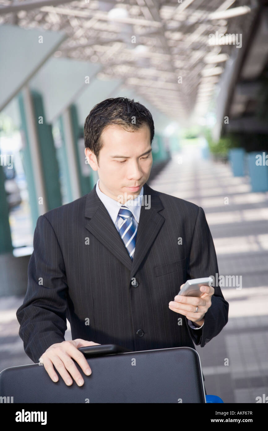Businessman using a palmtop Stock Photo