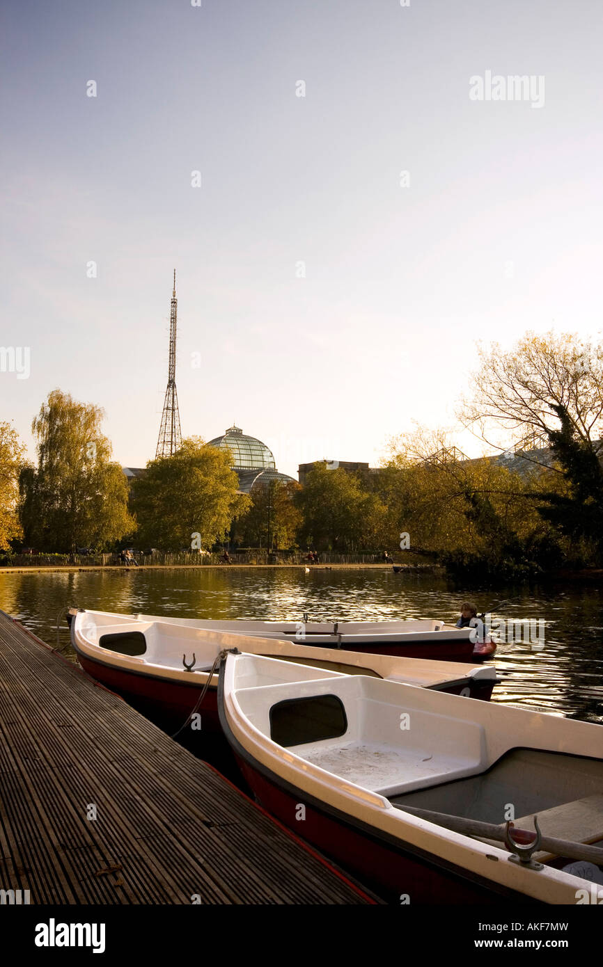 Boats on boating lake with Alexandra Palace in distance, London