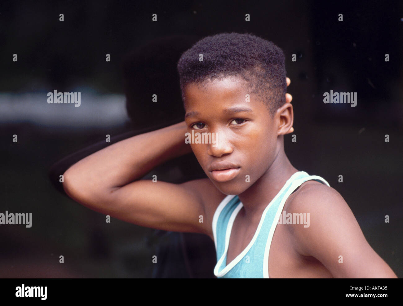 13 Year Old Boy Showing Off His Body With Short Haircut Stock