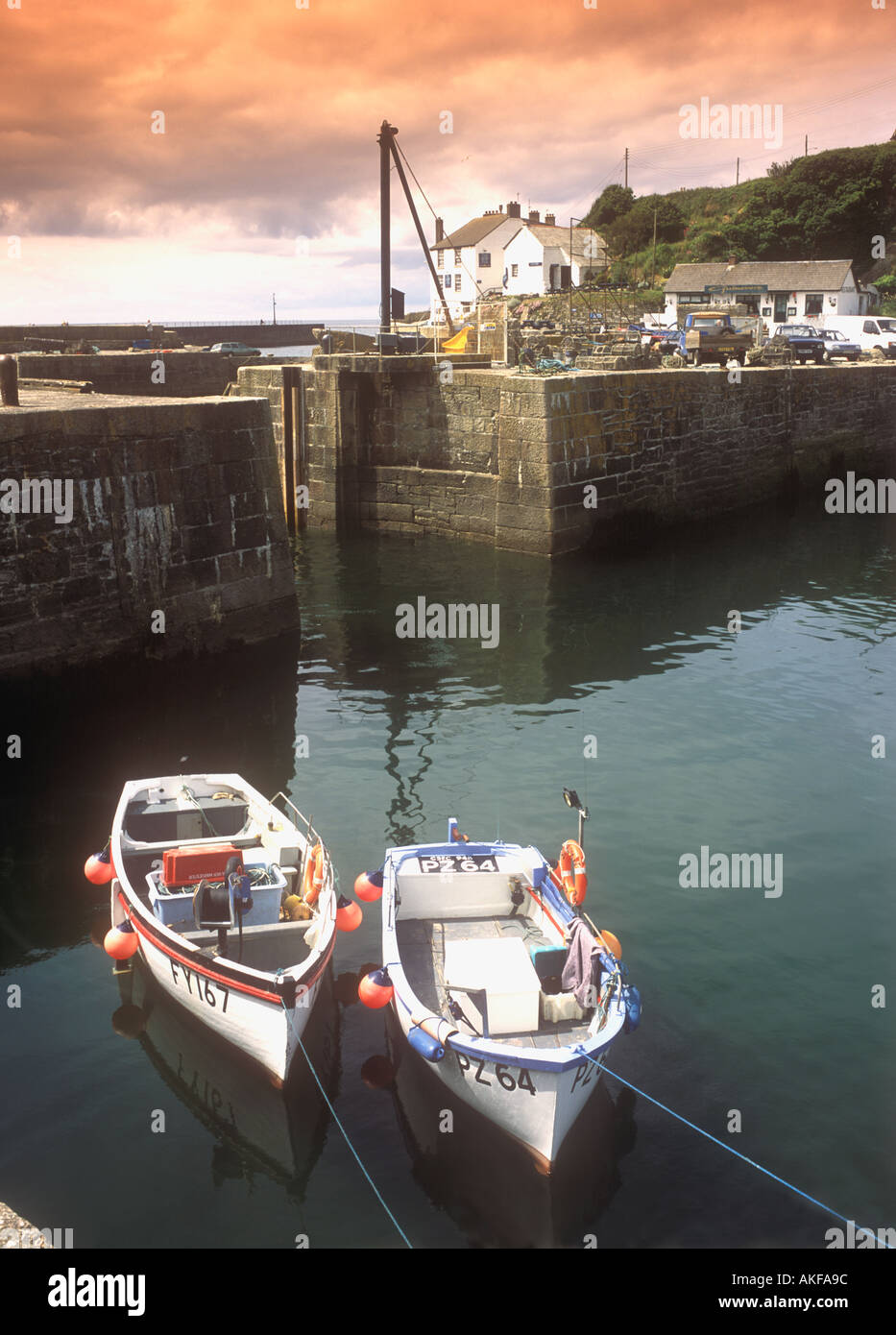 Harbour view and boats in the fishing village of Porthleven on the south coast of Cornwall in the UK Stock Photo