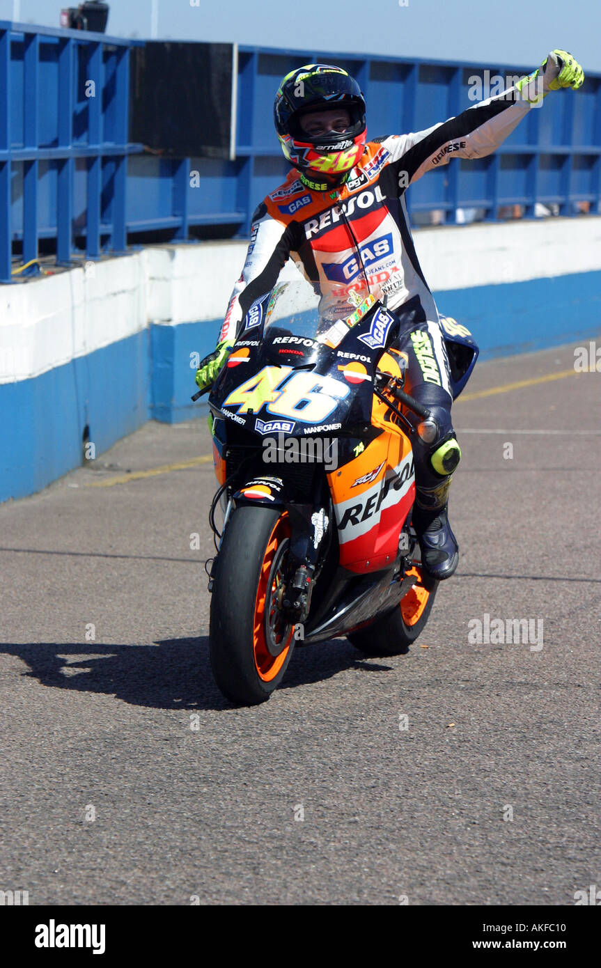 Valentino Rossi celebrating his believed British MotoGP victory at  Donington 2003 Stock Photo - Alamy