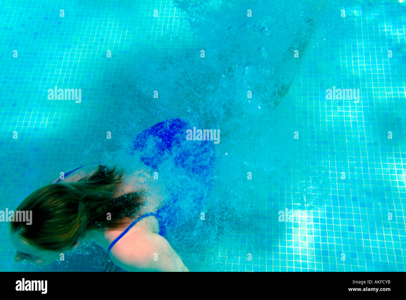 woman swimming in outdoor swimming pool from underwater Stock Photo - Alamy