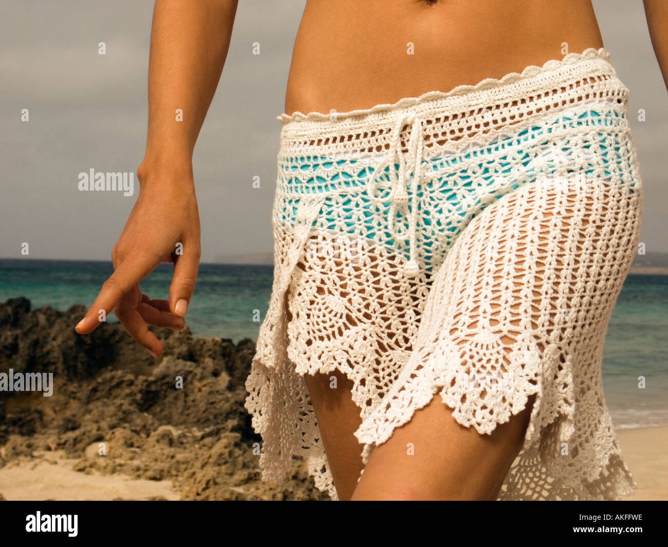 Woman walking Playa Migjorn, Formentera Stock Photo