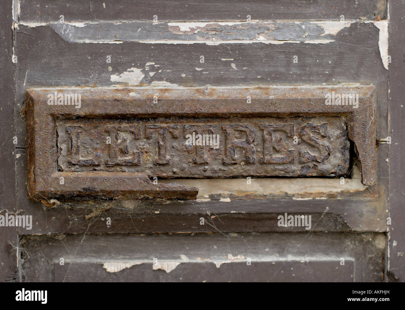 Old disused rusty iron letter box Normandy France Stock Photo