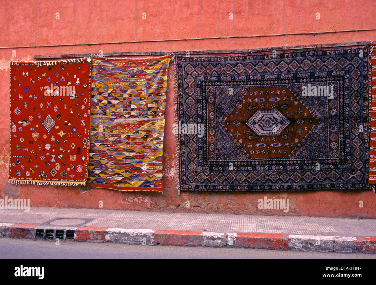 Carpets for sale hanging on wall Marrakesh Morocco Stock Photo Alamy