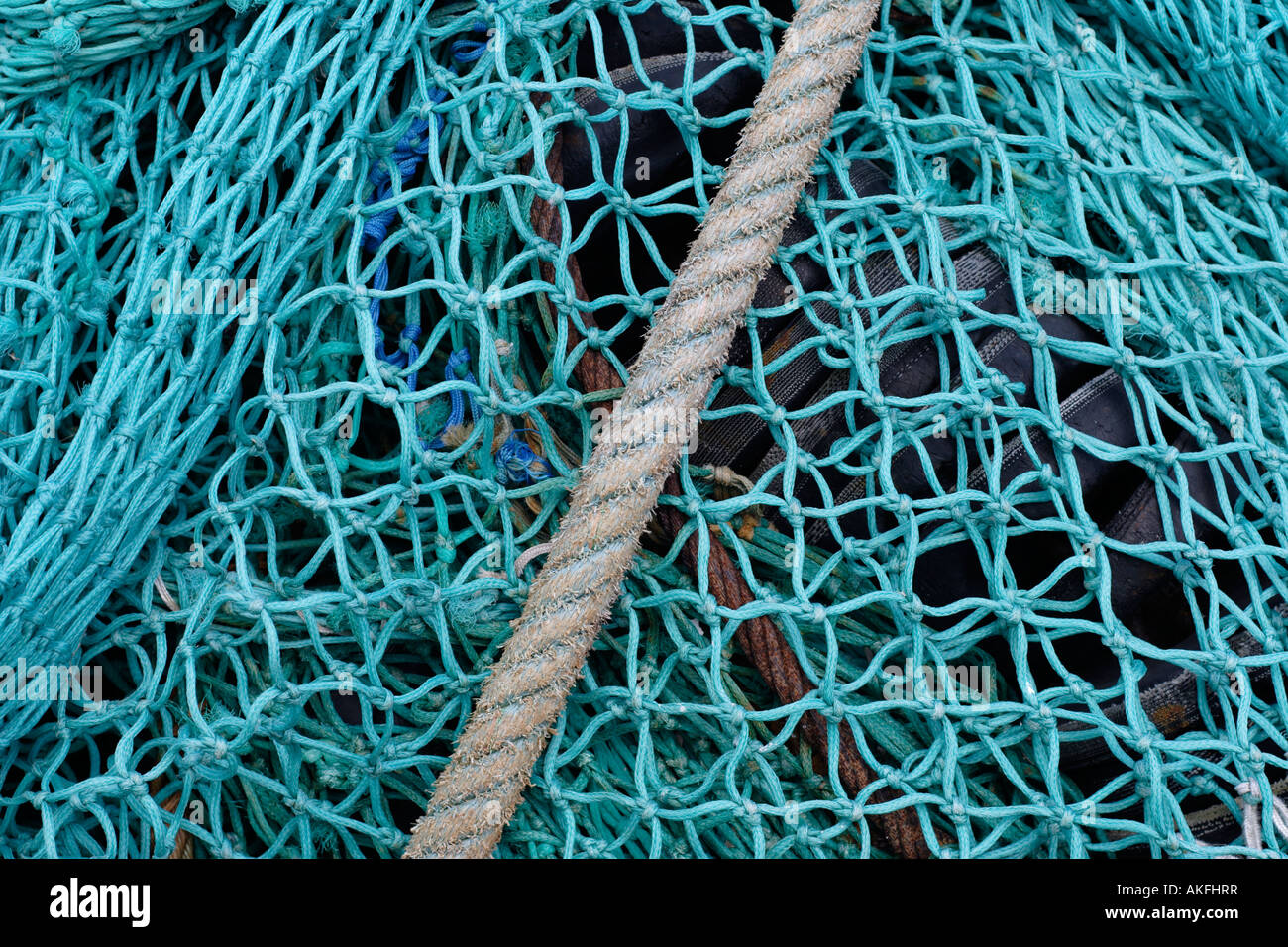 Detail of deep sea fishing nets and diagonal mooring rope Stock Photo -  Alamy