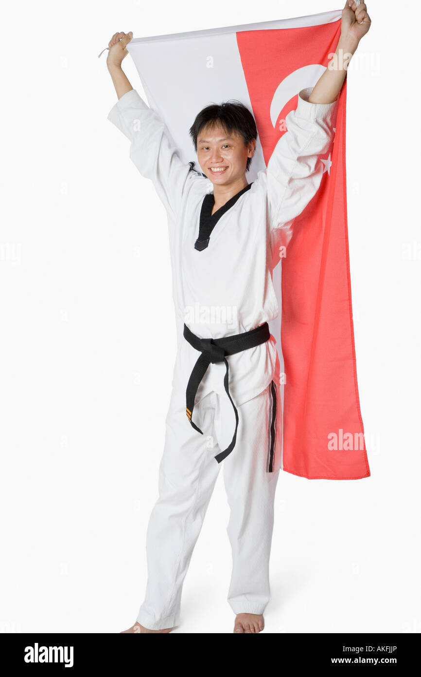 Portrait of a mid adult man holding a Chinese flag Stock Photo