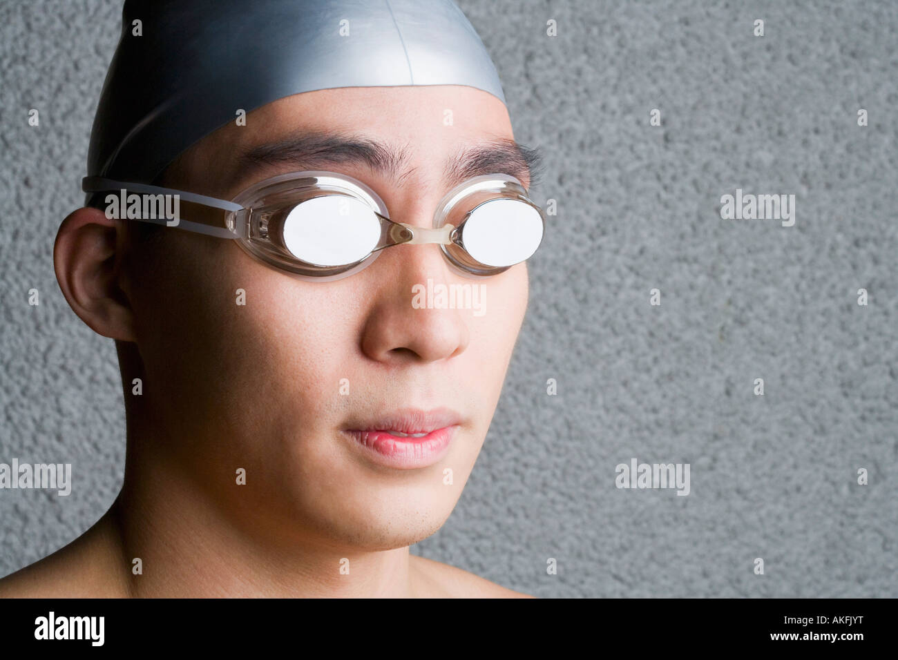 Close-up of a young man wearing swimming goggles Stock Photo