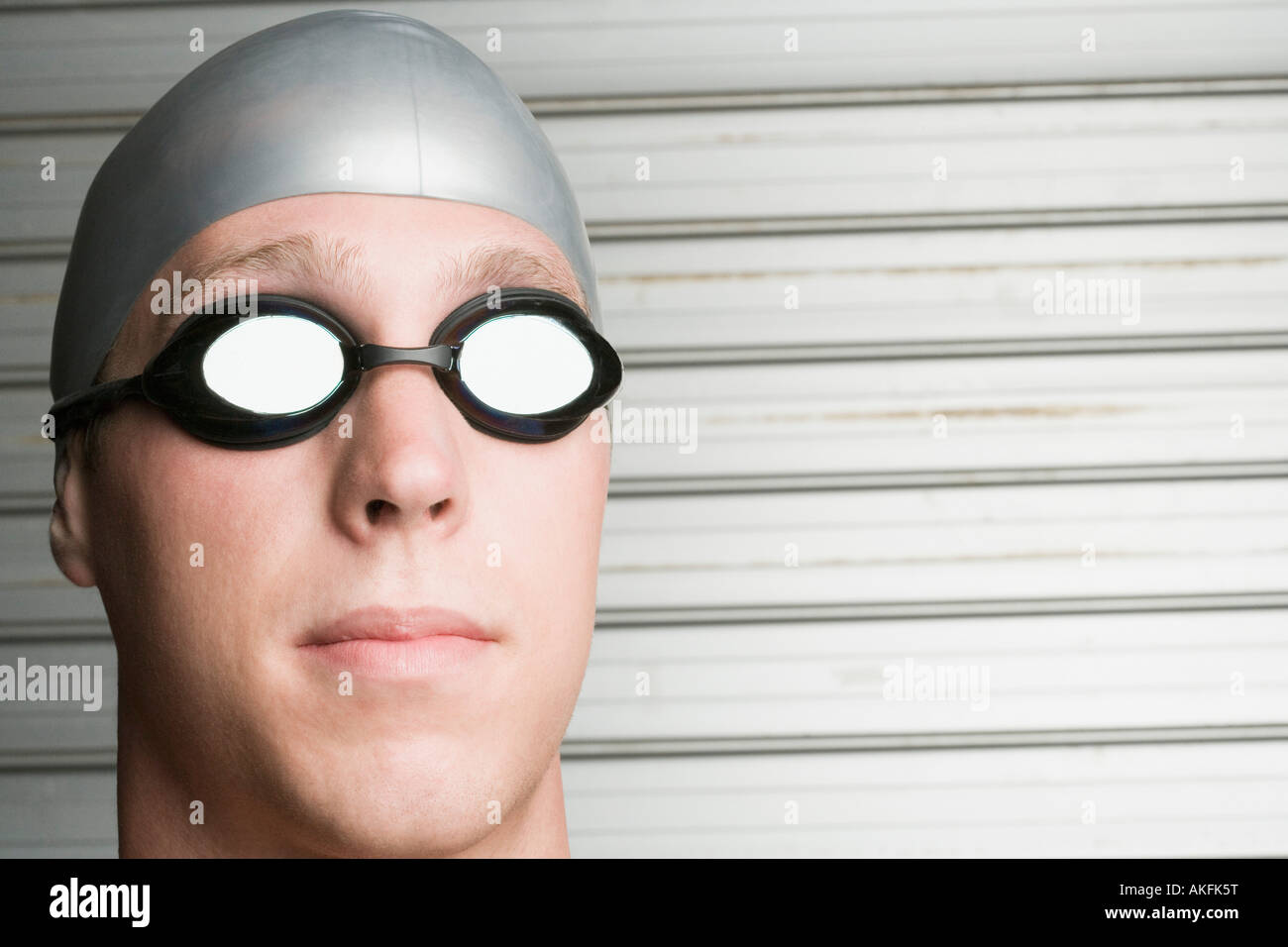 Close-up of a young man wearing swimming goggles Stock Photo