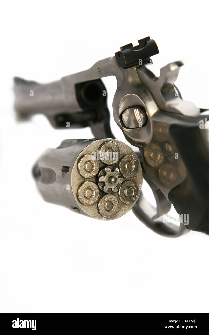 Open revolver hand gun that is loaded with bullets isolated on white