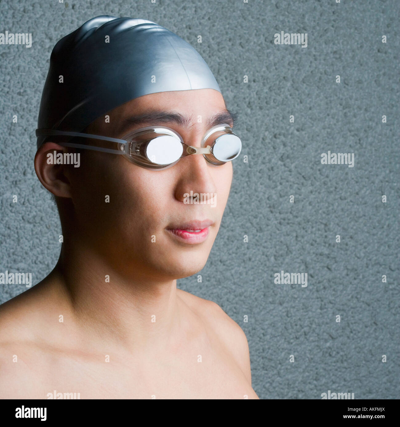 Close-up of a young man wearing swimming goggles Stock Photo