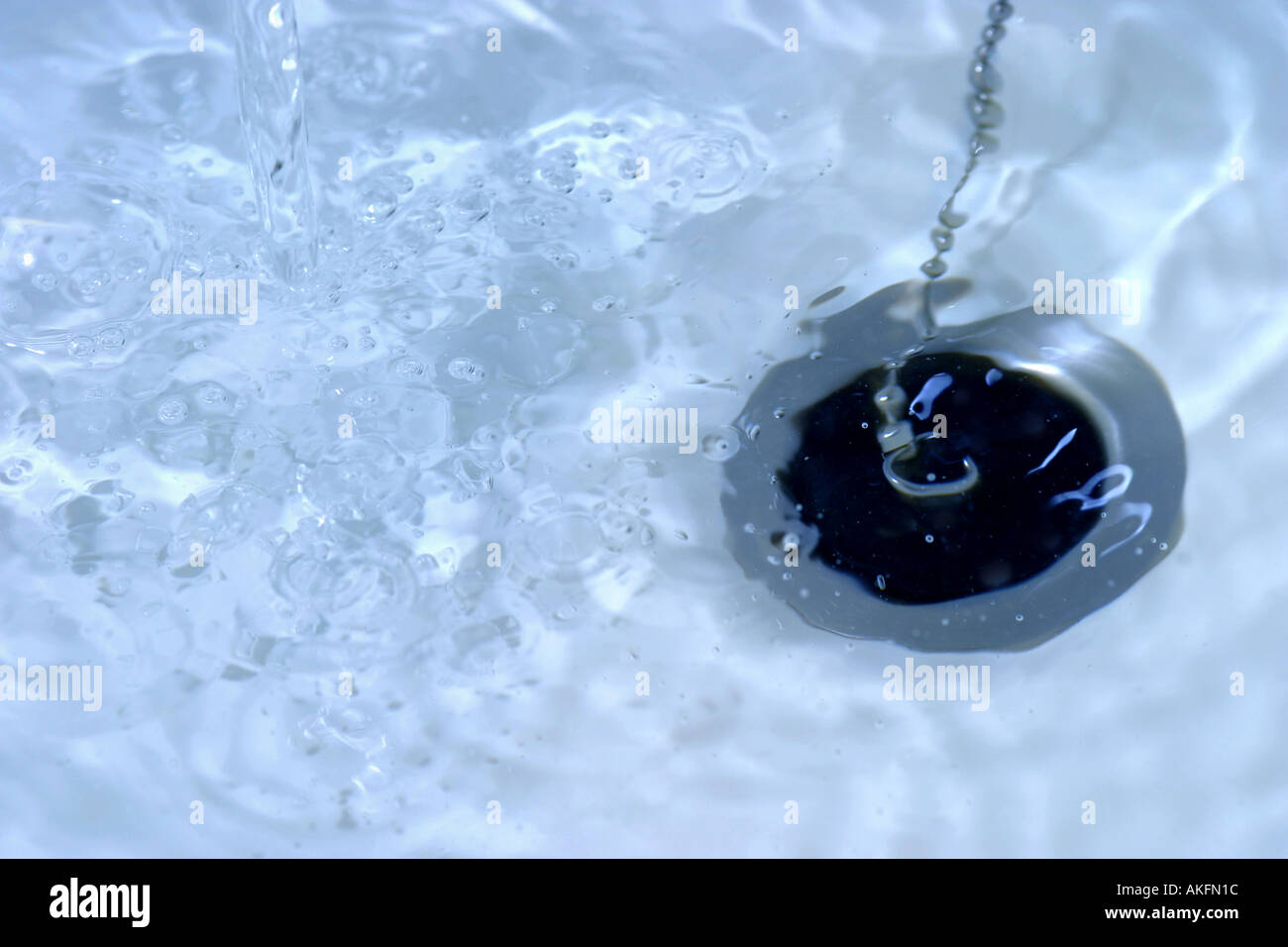 Water draining down plug or sink hole Stock Photo Alamy